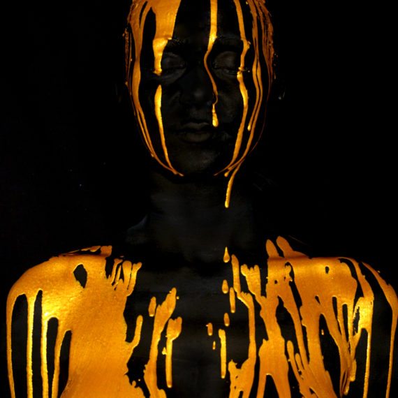 Body painting gold drip